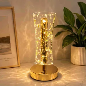 Ukrasna kristalna stona lampa sa zlatnim lampicama